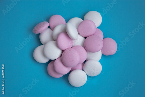 round candies on a blue background