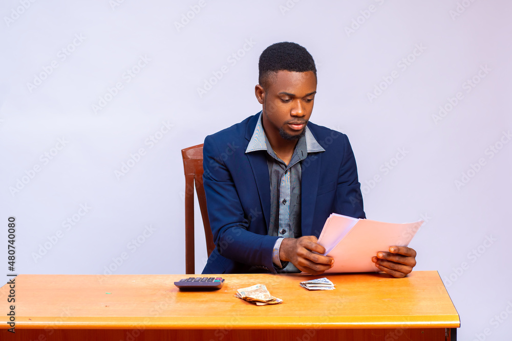 man going through the budget he just calculated man going through the budget he just calculated