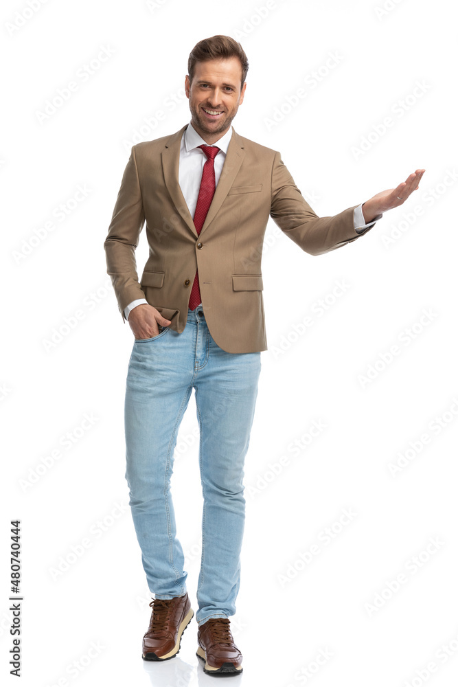 young businessman greeting someone with a smile on his face young businessman greeting someone with a smile on his face