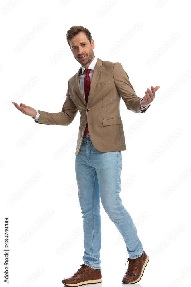 handsome businessman welcoming someone with his hands wide open handsome businessman welcoming someone with his hands wide open