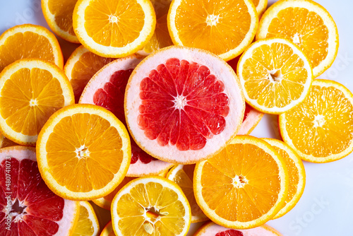 Slises of different citruses on the white background. Close-up of slised citruses.