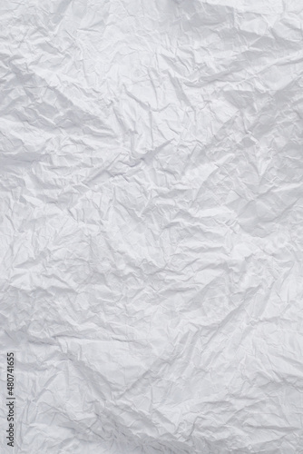Crumpled white paper background.