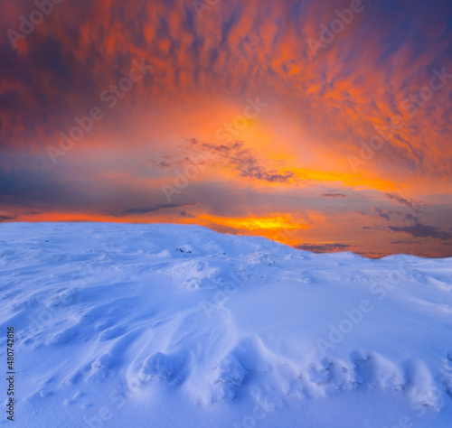 winter snowbound plain at the twilight, seasonal outdoor scene