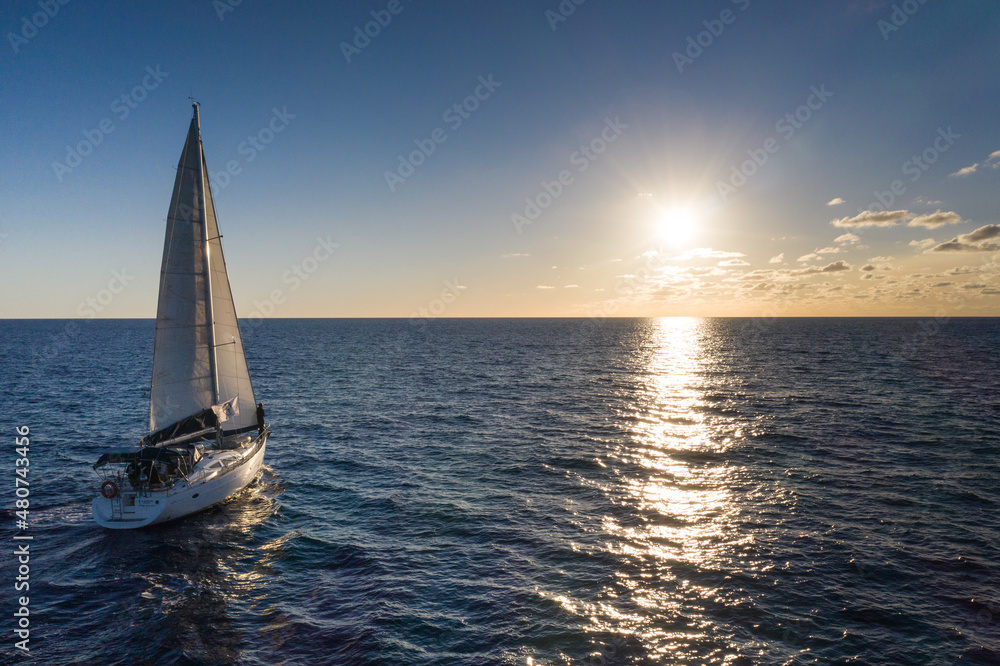 Obraz premium Sailing vessel on open water under clear skies in the atlantic ocean