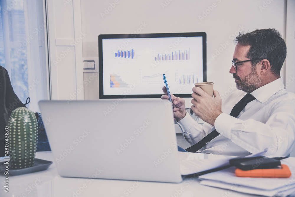 Business man working with laptop sitting at the desk. Male works at computer communicate online with remote office. Health care quarantine lifestyle, home working, homeschooling new technology concept