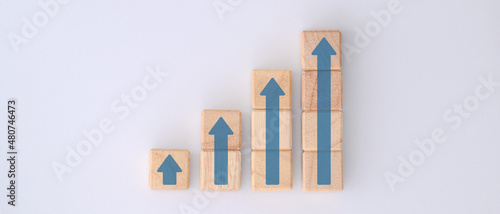Ladder career path for business growth success process concept. Wood block stacking as step stair with arrow up