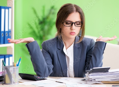 Slika na platnu Female financial manager working in the office