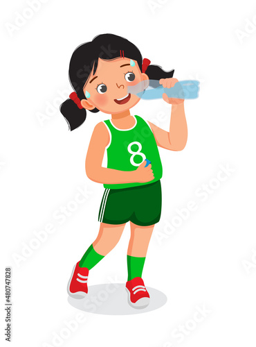 Cute little girl drinking fresh water from a bottle feeling thirsty after doing sport exercise