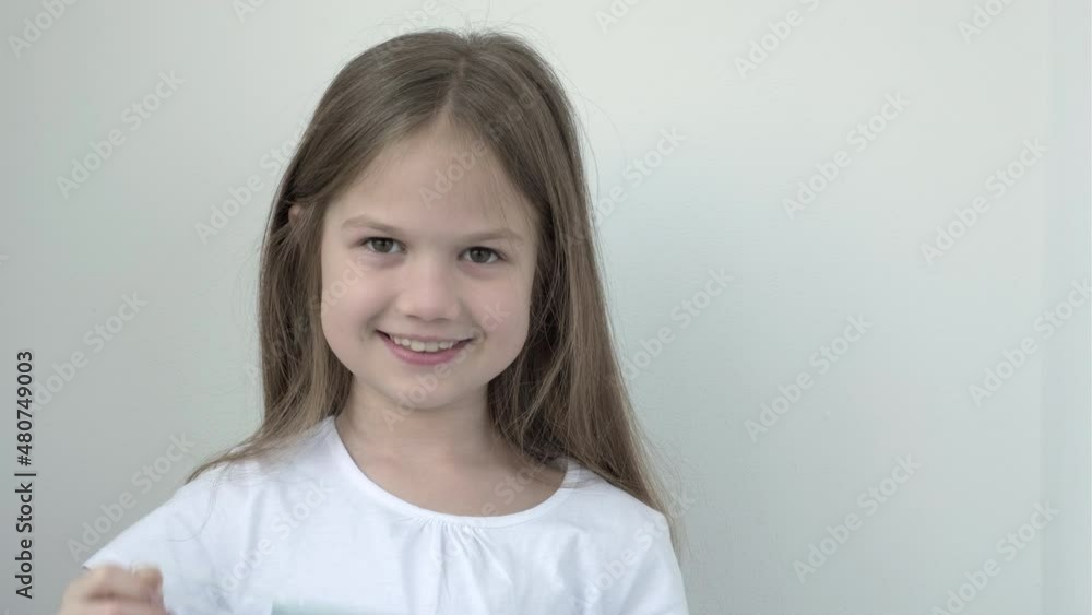 Little girl taking off protective face mask and breathing pure fresh air. Cute child removes mask and takes breath. Pandemic, breath free concept Little girl taking off protective face mask and breathing pure fresh air. Cute child removes mask and takes breath. Pandemic, breath free concept