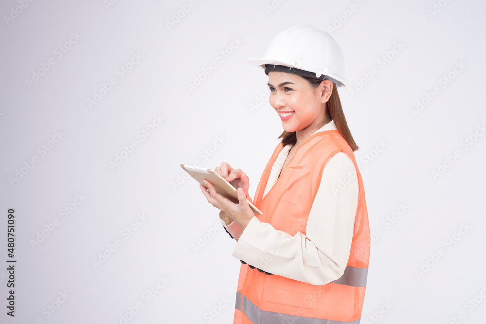 a woman engineer wearing a protective helmet over white background studio a woman engineer wearing a protective helmet over white background studio