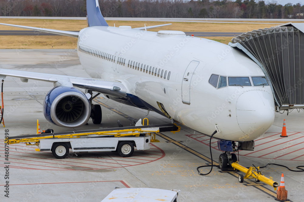 Preparation before flight with loading of cargo containers to airplane Preparation before flight with loading of cargo containers to airplane