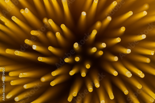 raw spaghetti pasta on stone background top view