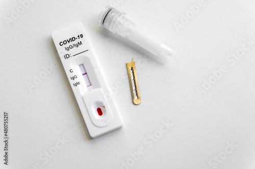 Test kit for viral disease COVID-19 2019-nCoV (coronavirus). Quick blood test shows a positive result for antigens for SARS-CoV-2 virus.