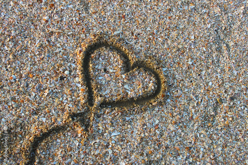 Heart balloon shape drawn at the beach