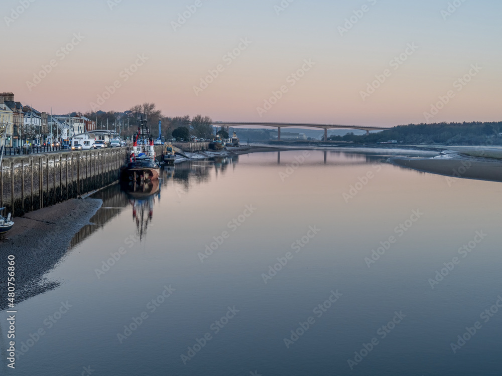 Winter dawn in Bideford, North Devon, England. Old boats and the New Bridge.