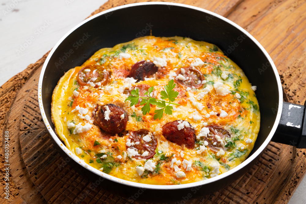 Frittata with egg, chorizo and cherry tomatoes. Frittata with egg, chorizo and cherry tomatoes.