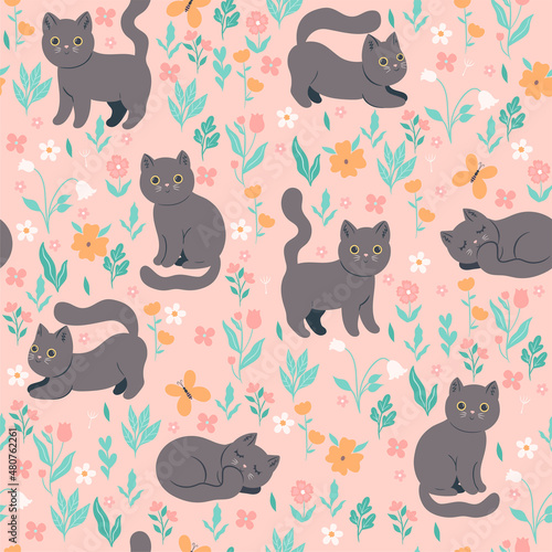 Seamless pattern with cute cats and flowers. Vector graphics.