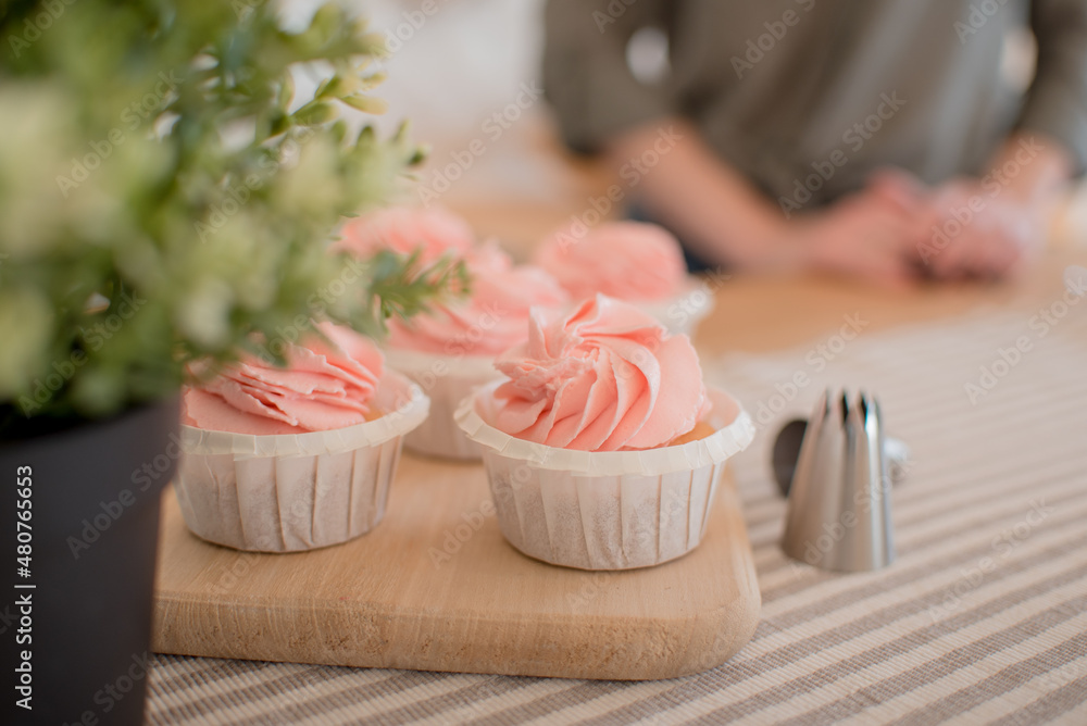beautiful pink cakes are on the table, on a stand