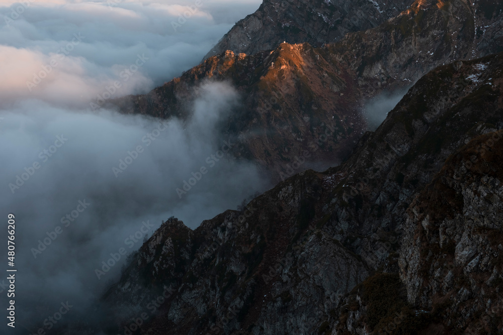 Fantastic dreamy sunrise on top of rocky mountain .Mountain view.Foggy Sunrise clouds. .Misty peaks.Foggy landscape background. Fantastic dreamy sunrise on top of rocky mountain .Mountain view.Foggy Sunrise clouds. .Misty peaks.Foggy landscape background.