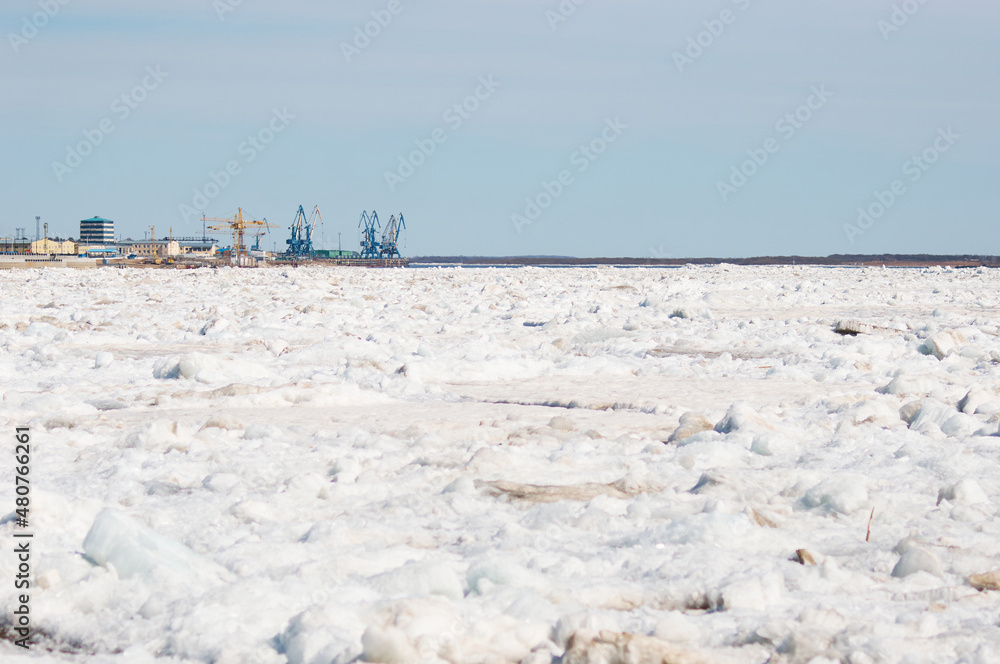 Spring view of the Amur river from the embankment of Blagoveshchensk, Russia. Ice drift.