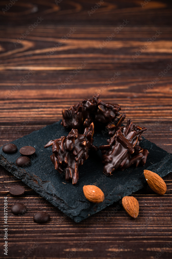 almonds in dark chocolate close up almonds in dark chocolate close up