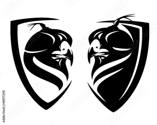 falcon wearing hood cover and simple heraldic shield - hunting bird black and white vector head portrait insignia badge design
