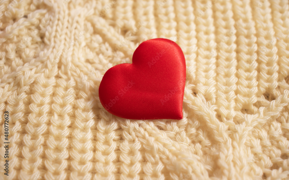red heart on fabric background