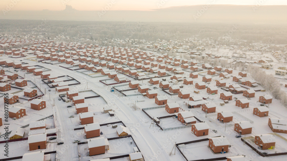 Fototapeta premium view of a cottage settlement in the Nizhny Novgorod region in winter