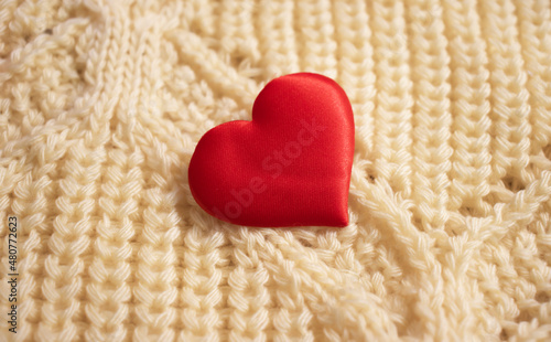 red heart on fabric background