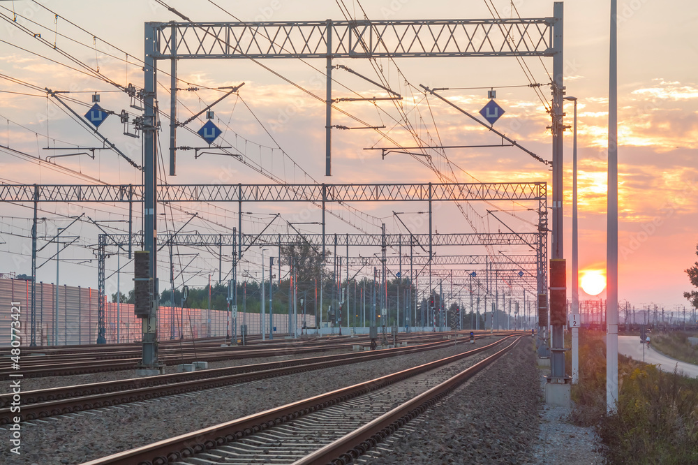 Railroad Tracks and Overhead Lines at Sunset