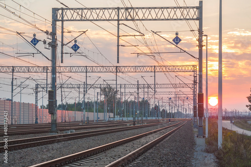Railroad Tracks and Overhead Lines at Sunset