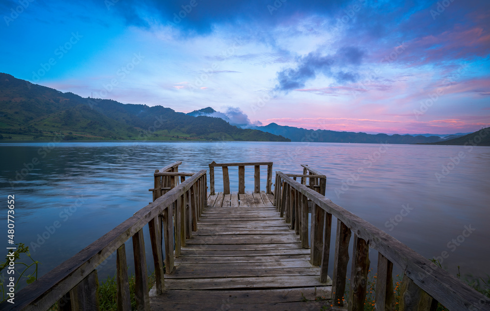 Fototapeta premium pier at sunrise guatemala