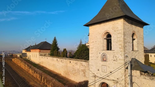 Aerial drone view of the Cetatuia Monastery in Iasi, Romania. Main church, inner court and ancient walls, city on the background photo