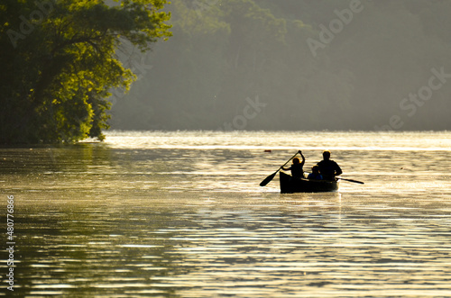 A family enjoys boat ride in Potomac River during sunset - Washington DC United States