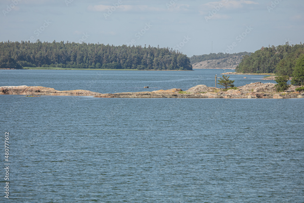 Rocky islands in the sea. Summer, sunny day Nature of Scandinavia. islands in the sea. Finland. Turku Archipelago Rocky islands in the sea. Summer, sunny day Nature of Scandinavia. islands in the sea. Finland. Turku Archipelago