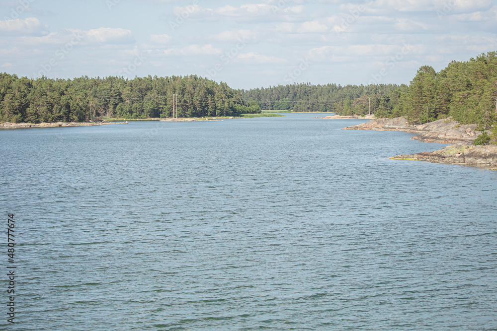 Rocky islands in the sea. Summer, sunny day Nature of Scandinavia. islands in the sea. Finland. Turku Archipelago Rocky islands in the sea. Summer, sunny day Nature of Scandinavia. islands in the sea. Finland. Turku Archipelago