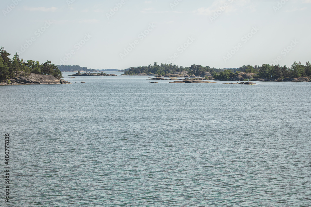 Rocky islands in the sea. Summer, sunny day Nature of Scandinavia. islands in the sea. Finland. Turku Archipelago Rocky islands in the sea. Summer, sunny day Nature of Scandinavia. islands in the sea. Finland. Turku Archipelago