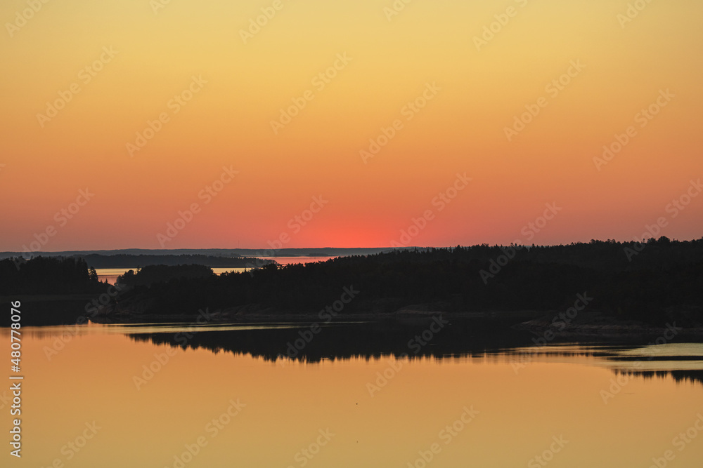 Early summer dawn over the sea. Nature of Scandinavia. islands in the sea. Finland. Turku Archipelago.