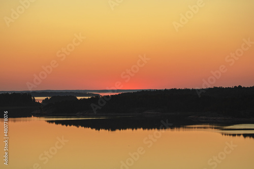 Early summer dawn over the sea. Nature of Scandinavia. islands in the sea. Finland. Turku Archipelago.