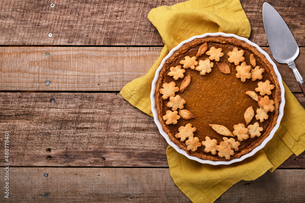 Pumpkin Pie. Tart with whipped cream and cinnamon on rustic background. Traditional american homemade pumpkin cake for Thanksgiving or Halloween Ready to eat. Mock up. Pumpkin Pie. Tart with whipped cream and cinnamon on rustic background. Traditional american homemade pumpkin cake for Thanksgiving or Halloween Ready to eat. Mock up.