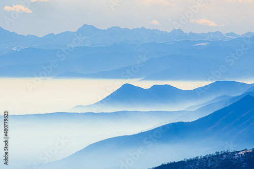 misty italian mountain panorama that looks like sea