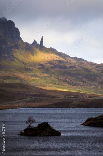 Loch Leathan and Old man of Storr rock formations, Isle of Skye, Scotland. Concept: typical Scottish landscape, tranquility and serenity, particular morphologies.