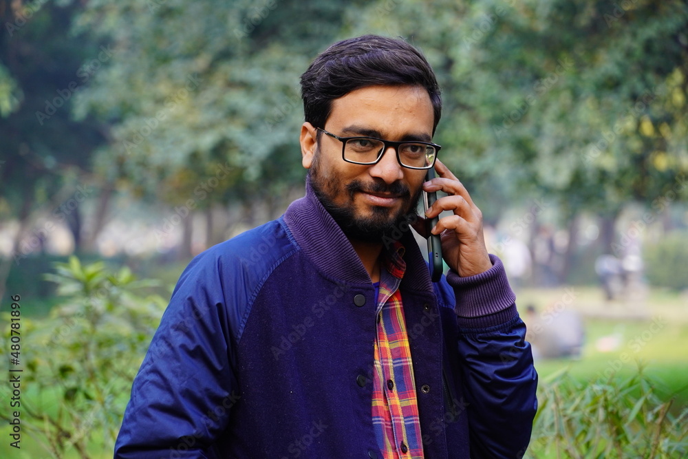 Our Indian man talking with his phone with someone Our Indian man talking with his phone with someone