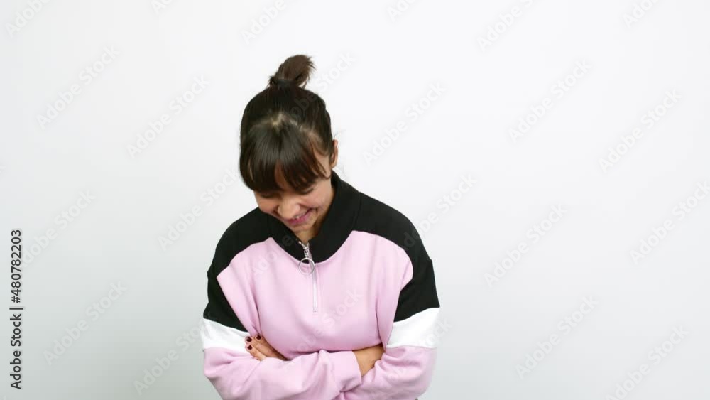 Pretty woman keeping the arms crossed while smiling over isolated background Pretty woman keeping the arms crossed while smiling over isolated background
