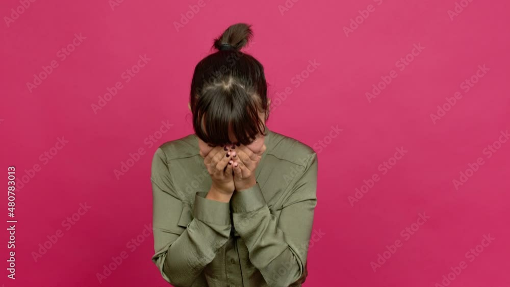 Pretty woman smiling a lot while covering mouth over isolated background Pretty woman smiling a lot while covering mouth over isolated background