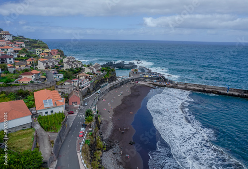 Aerial drone view of black sand beach in Seixal city, Madeira island photo