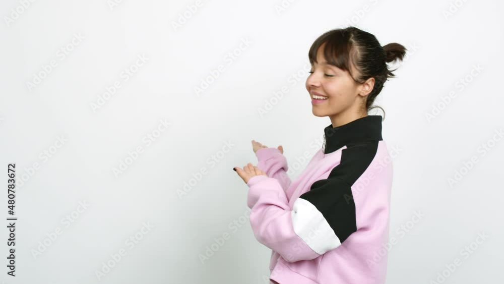 Pretty woman pointing back and presenting a product over isolated background Pretty woman pointing back and presenting a product over isolated background