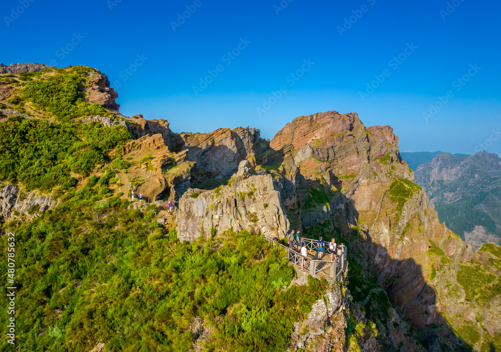 Aerial view of the mountains range in Madeira Island with a views balcony on a trail between Pico Ruivo and Pico Areeiro peaks