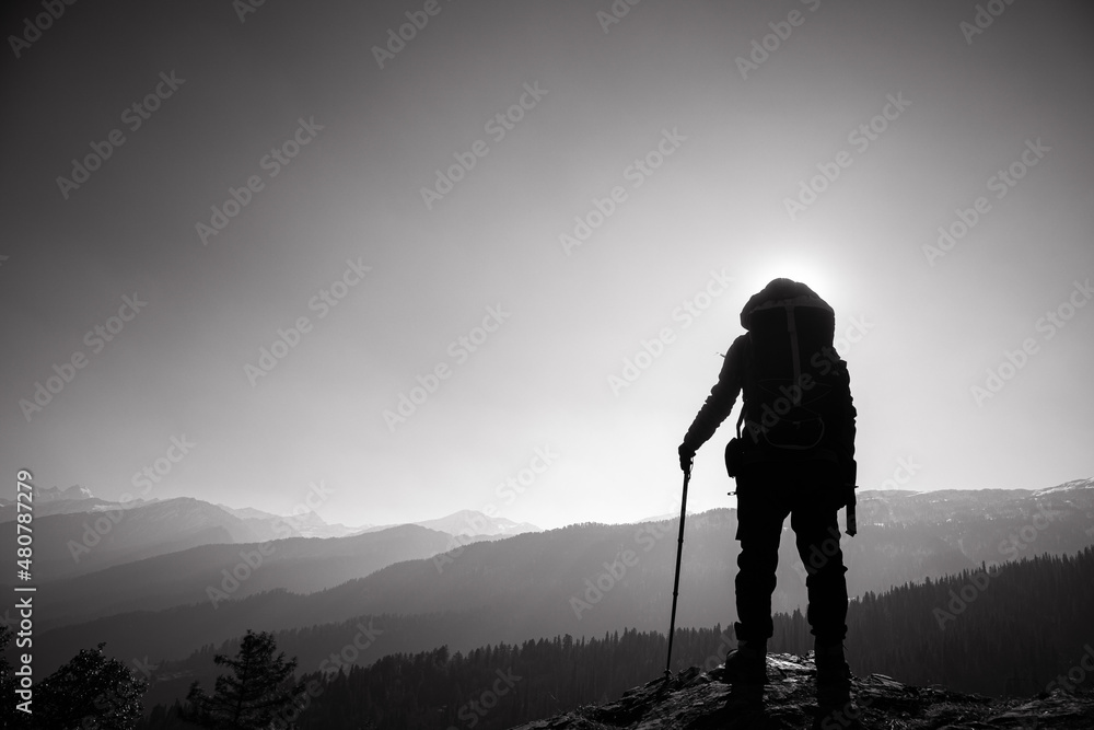 An silhouette of an accomplished mountain hiker in the Himalayan mountains