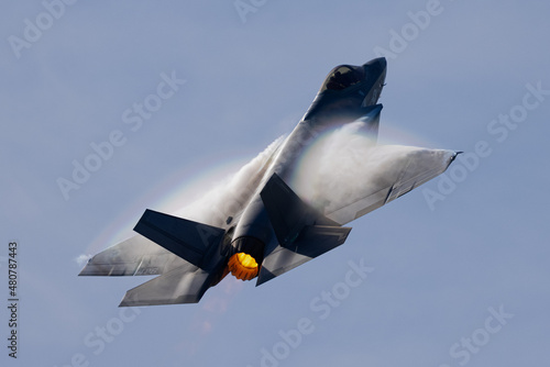 Very unusual close view of a F-35C  in a high G maneuver , with condensation clouds over the wings and afterburner on